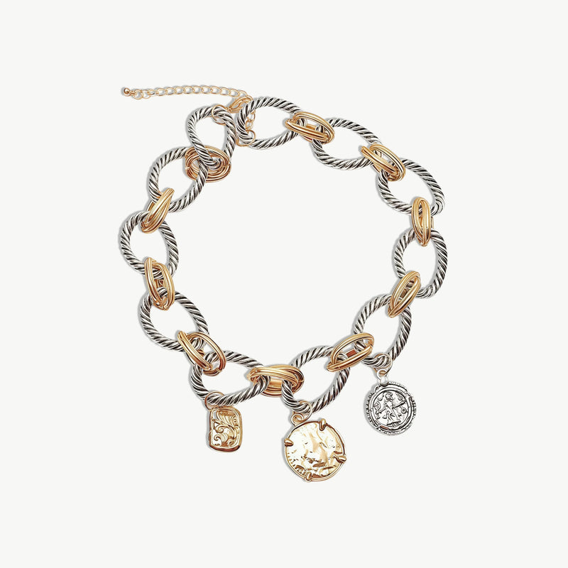 Close-up of antiqued gold twisted chain links on a statement necklace