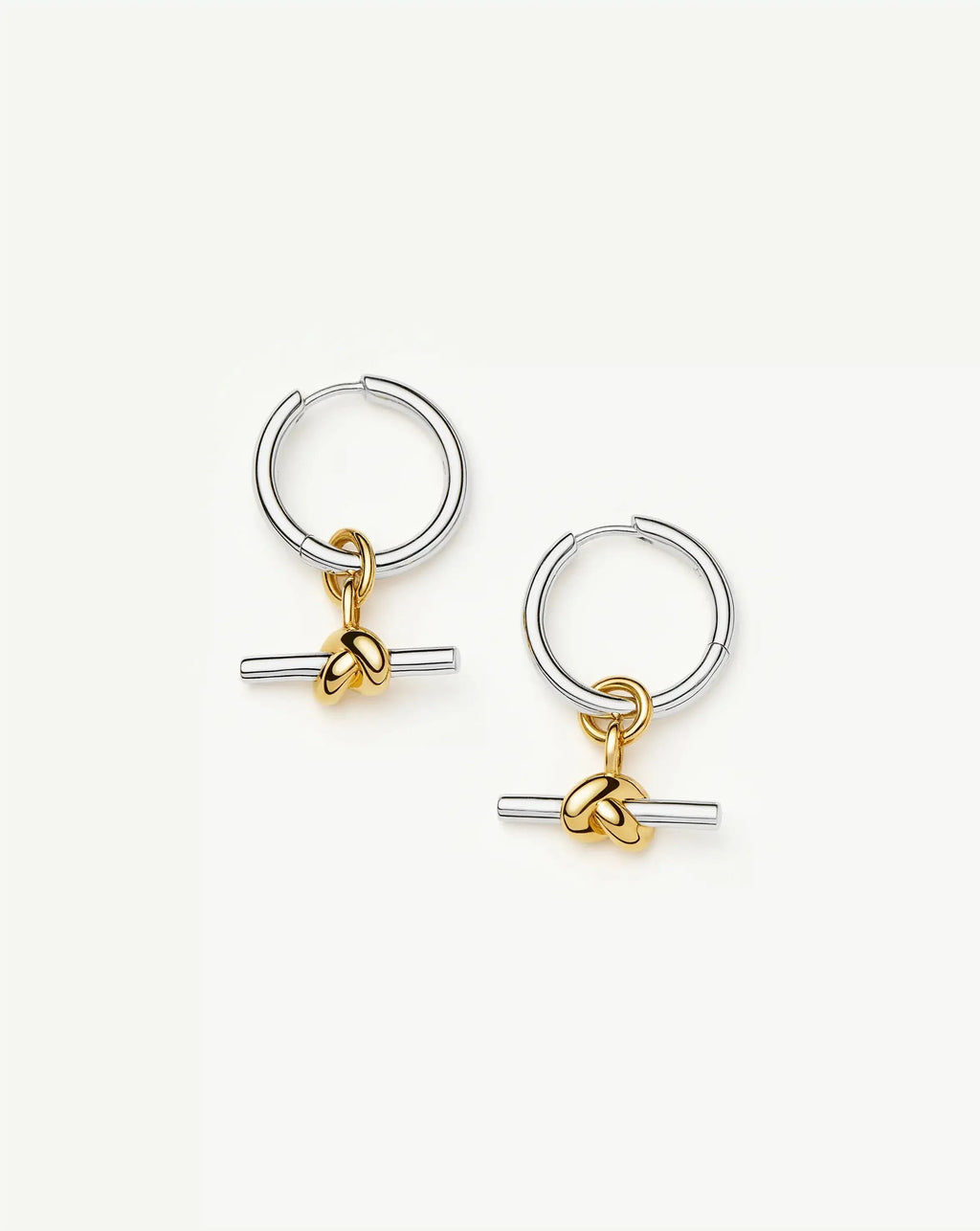 Knot T-bar charm hoop earrings in mixed gold and silver tones, front view